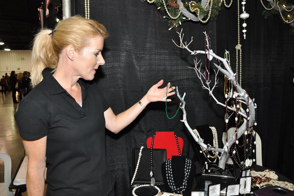 Shopper at The Christmas Company Considers a Purchase